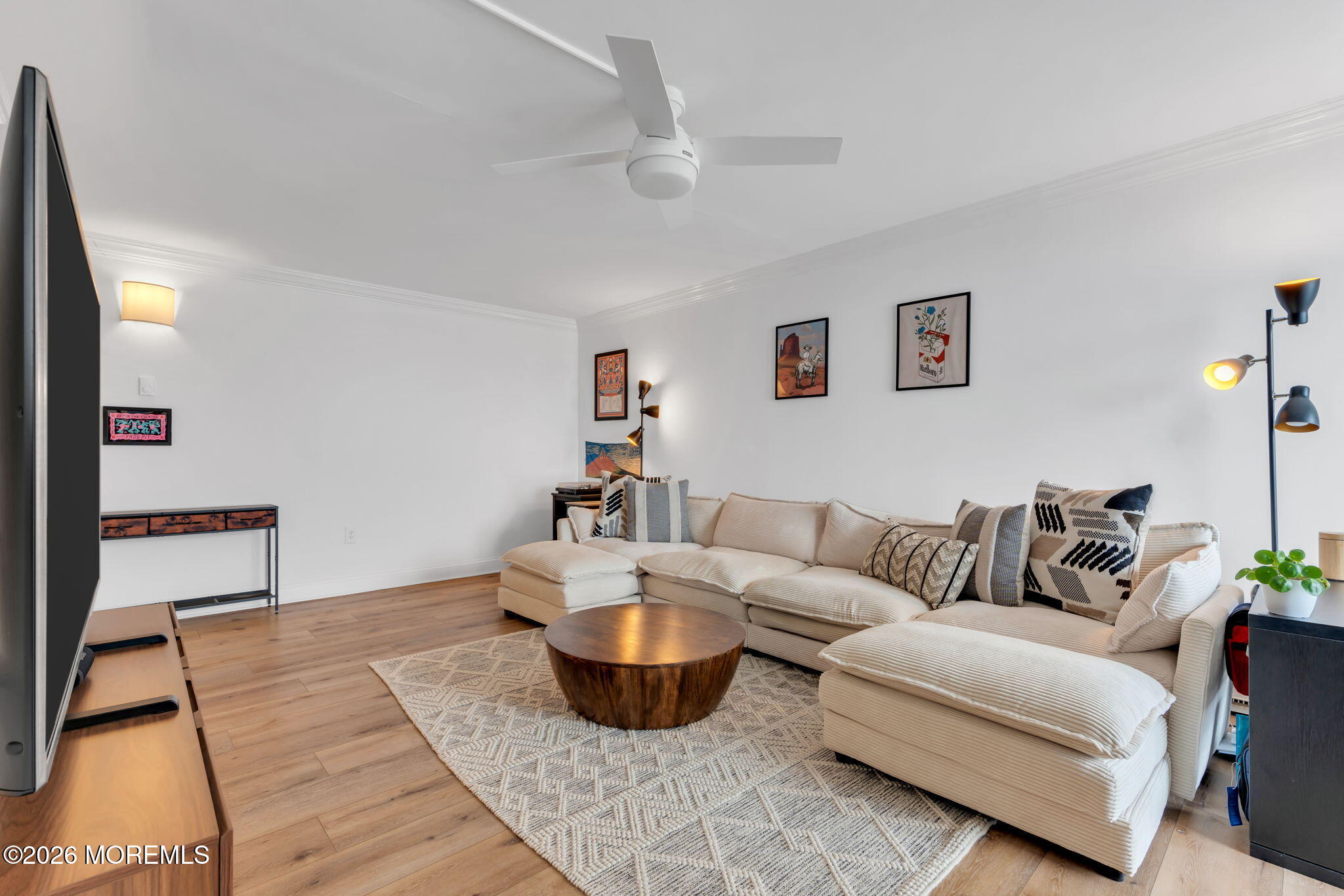 1000 River Road, Unit 7G Belmar, NJ 07719 - Photo 4 of 25 a living room with furniture and a wooden floor