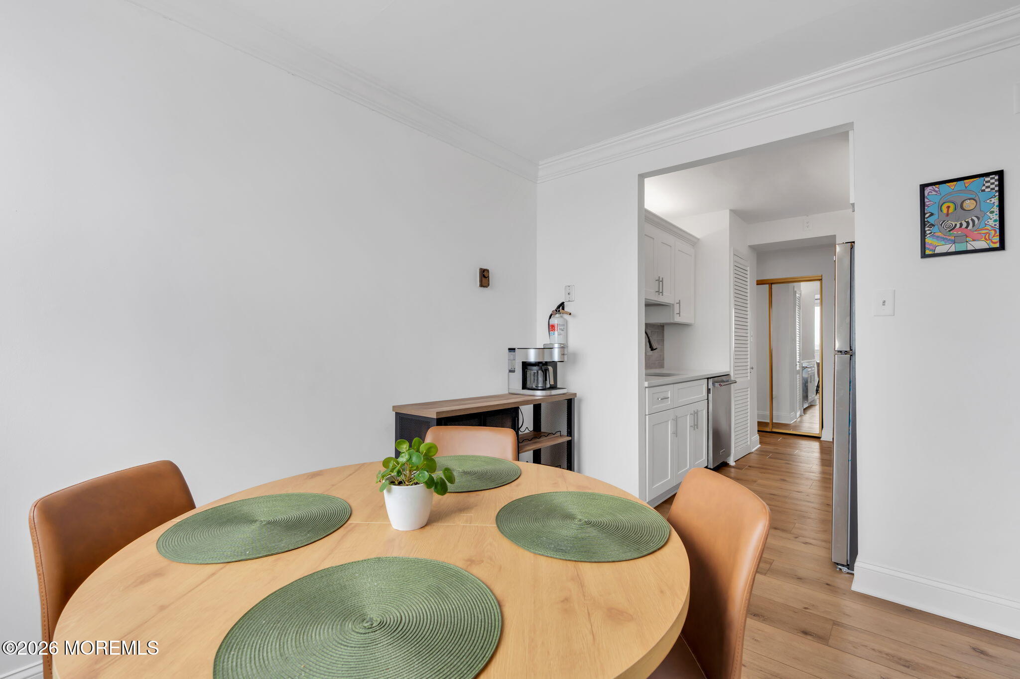 1000 River Road, Unit 7G Belmar, NJ 07719 - Photo 7 of 25 a living room with furniture and wooden floor