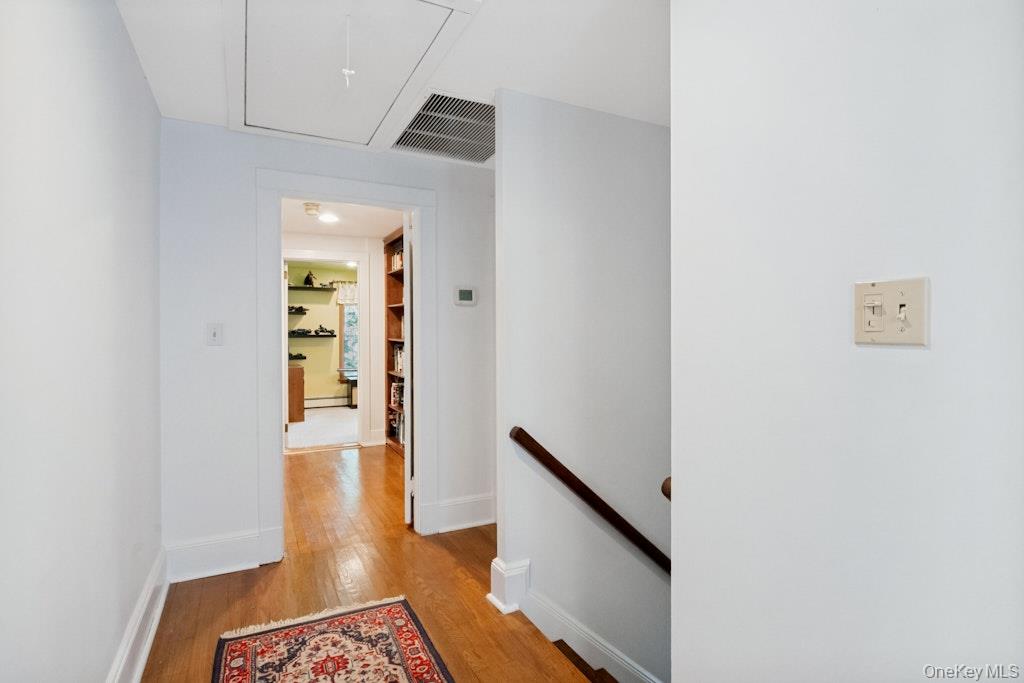 312 Quaker Road Chappaqua, NY 10514 - Photo 19 of 36 a view of an entryway with wooden floor