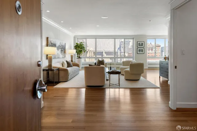 a living room with fireplace furniture and a wooden floor