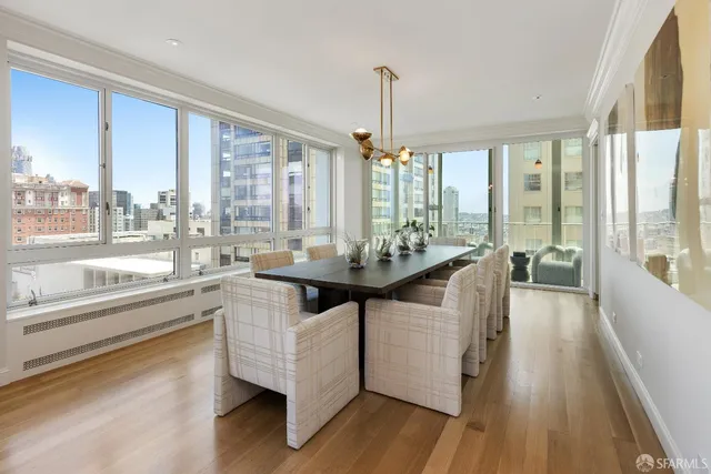 a view of a kitchen with kitchen island granite countertop a large window