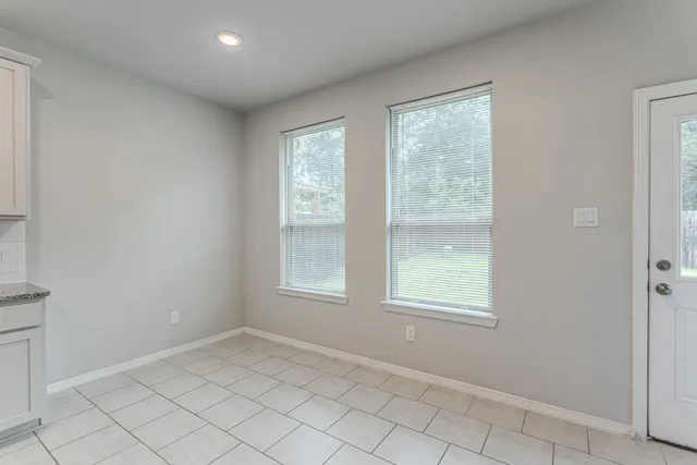 an empty room with windows