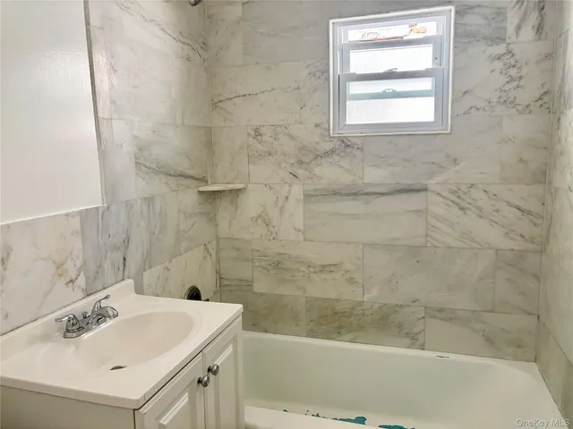 a bathroom with a sink and a bathtub