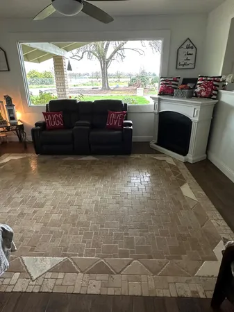 a living room with couch and a chandelier