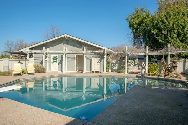 a view of a tree in front of a house
