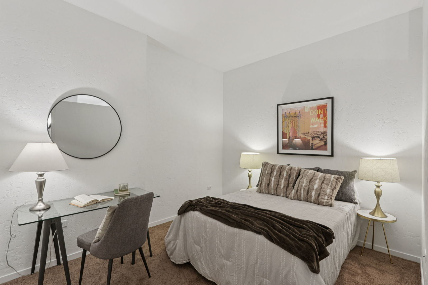 807 Davis Street, Unit 403 Evanston, IL 60201 - Photo 16 of 23 a bedroom with a bed lamp and a mirror