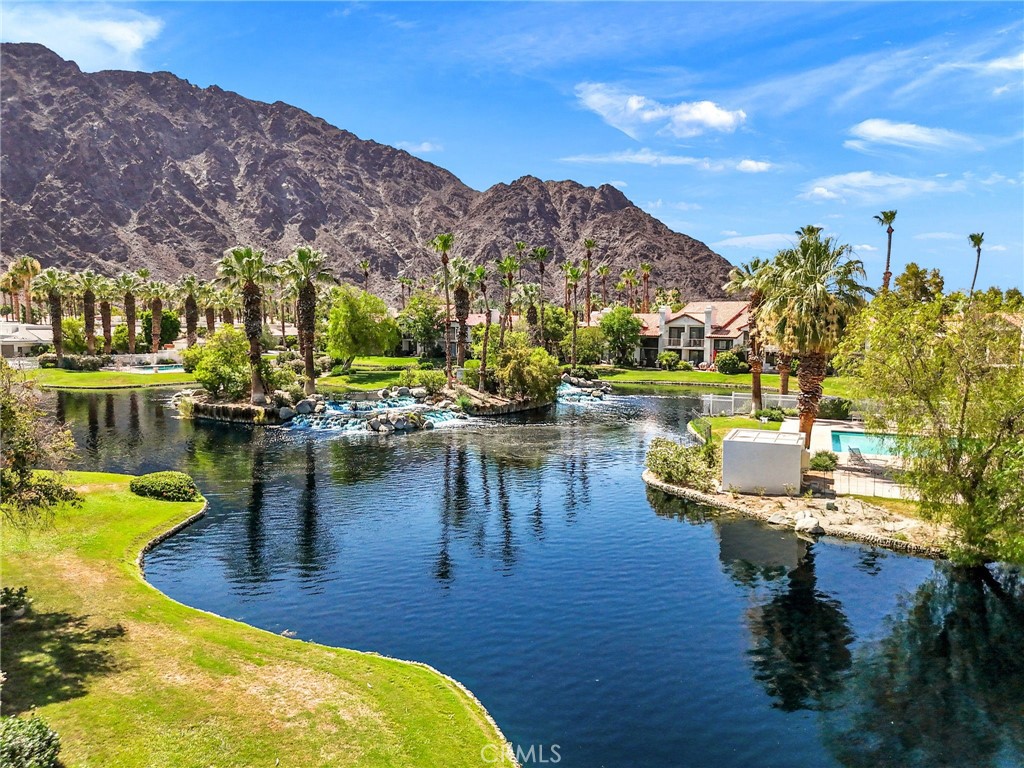 79822 Olympia Fields La Quinta, CA 92253 - Photo 2 of 48 a view of a lake with a mountain