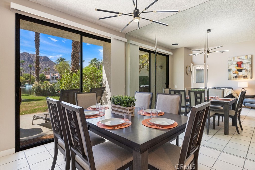 79822 Olympia Fields La Quinta, CA 92253 - Photo 9 of 48 a view of a dining room with furniture window and outside view