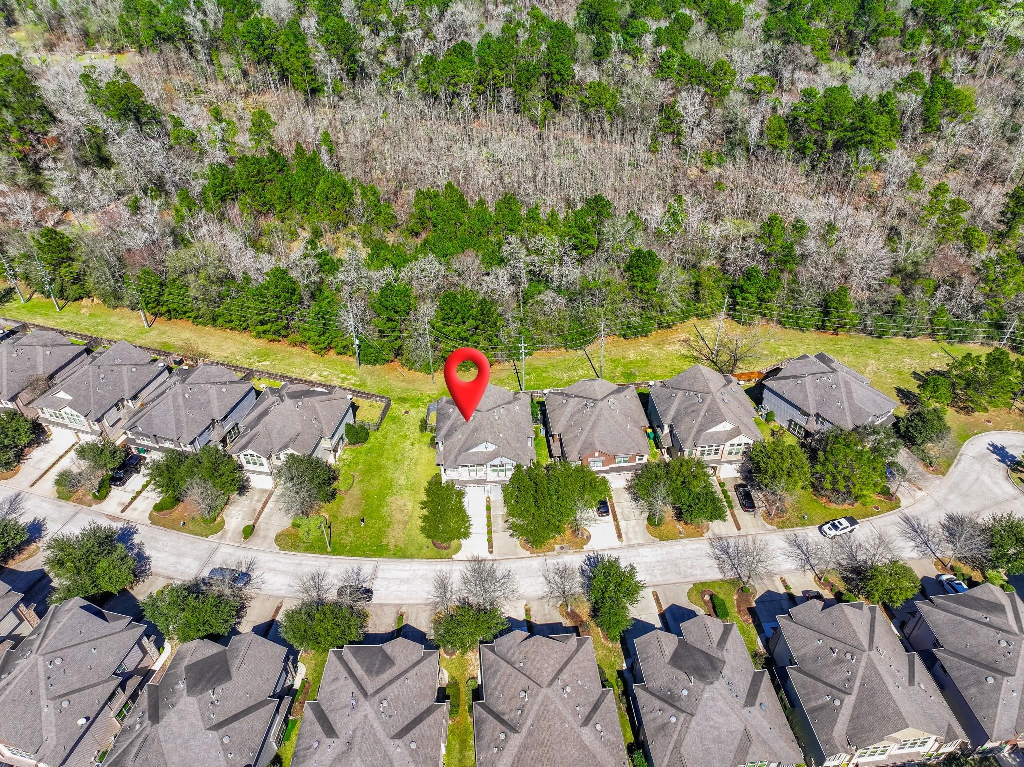 58 Aventura Place Spring, TX 77389 - Photo 23 of 23 an aerial view of residential house with outdoor space and swimming pool