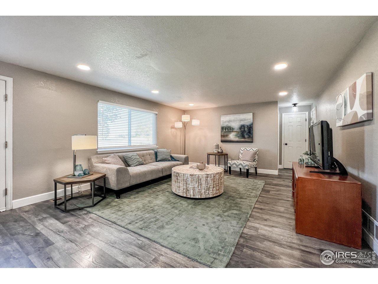 7982 Liley Avenue Frederick, CO 80530 - Photo 13 of 40 Gather the family together for a movie night in the family room.