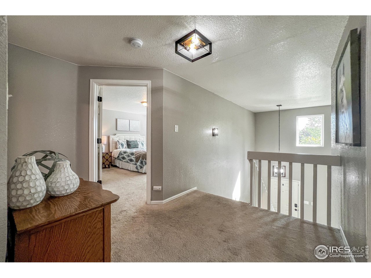 7982 Liley Avenue Frederick, CO 80530 - Photo 18 of 40 Open upstairs landing leads to the 3 bedrooms.