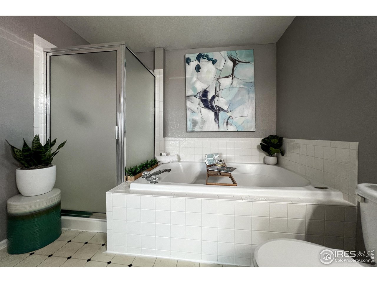 7982 Liley Avenue Frederick, CO 80530 - Photo 23 of 40 The en-suite bathroom has a separate shower and luxurious soaking tub.