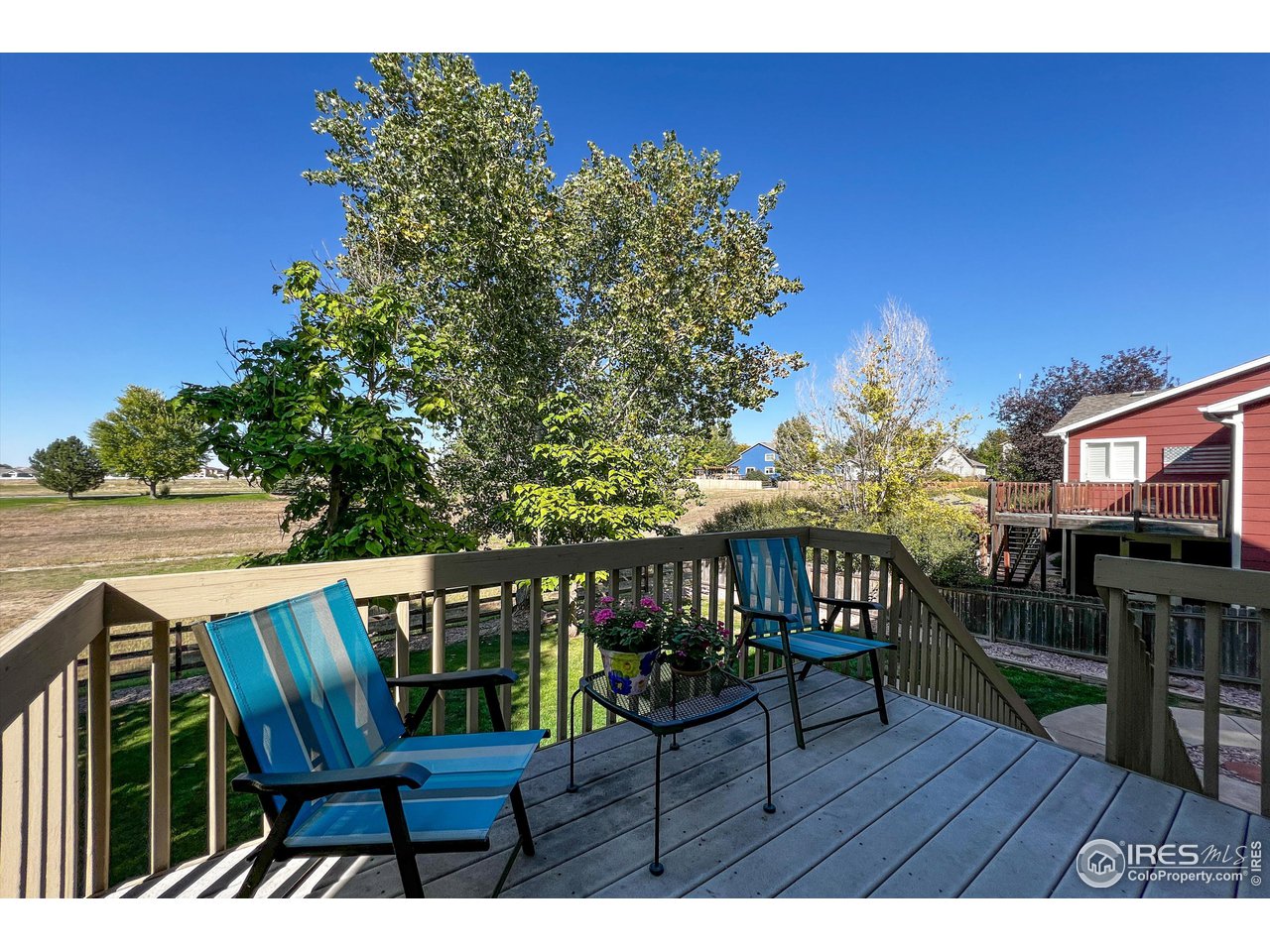7982 Liley Avenue Frederick, CO 80530 - Photo 37 of 40 Grab a cool beverage and relax on the back deck in the warm sunshine.