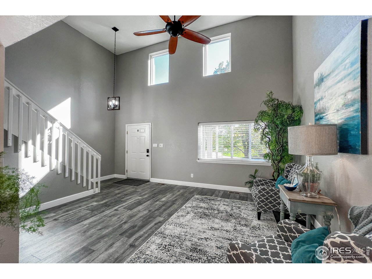 7982 Liley Avenue Frederick, CO 80530 - Photo 5 of 40 The sky-highceiling and abundant natural light give this room an open and cheery feel.
