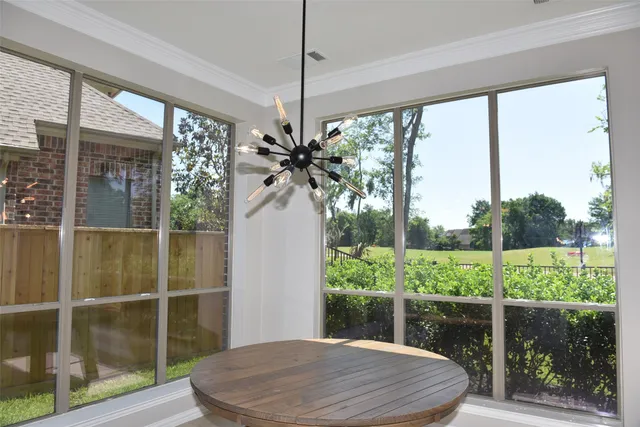 a room with a large window and table