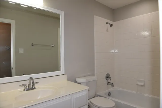 a bathroom with a sink toilet tub and shower