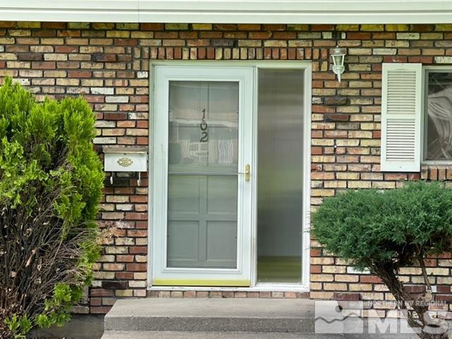 102 Smithridge Reno, NV 89502 - Photo 17 of 20 a front view of a house with a garden