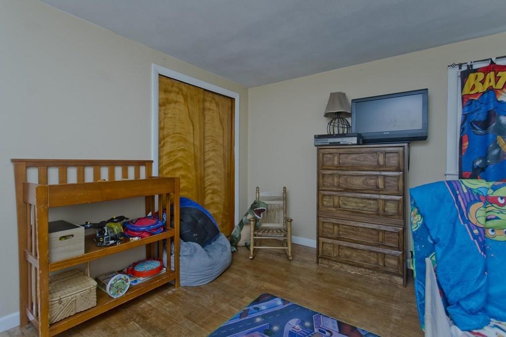 34 Glenn Street Three Rivers, MA 01080 - Photo 23 of 40 a bedroom with a bed and a television