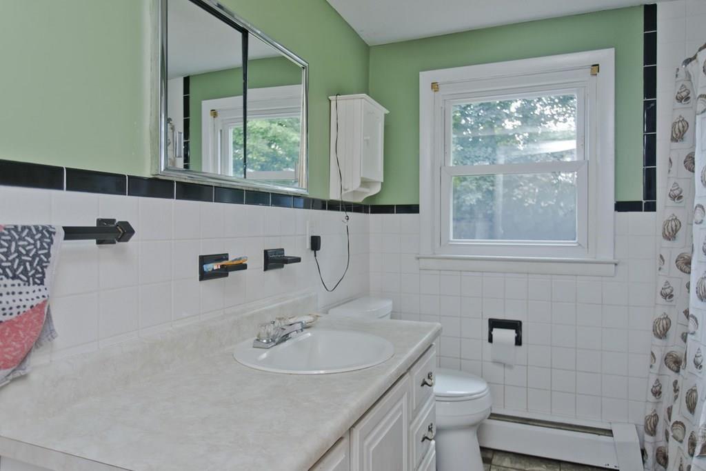 34 Glenn Street Three Rivers, MA 01080 - Photo 27 of 40 a bathroom with a sink a toilet and a mirror