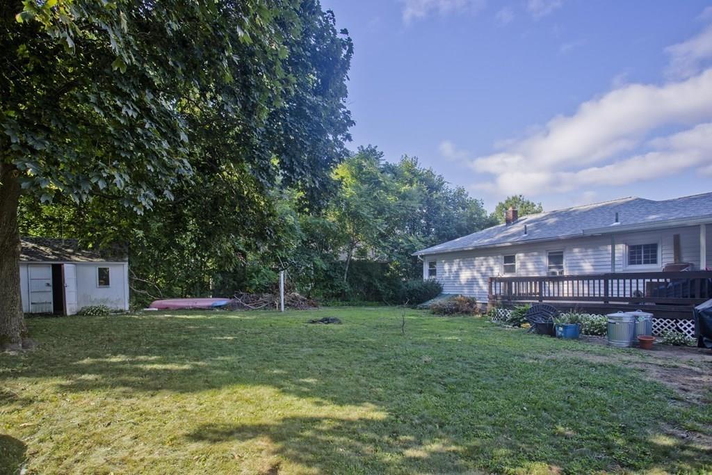 34 Glenn Street Three Rivers, MA 01080 - Photo 39 of 40 a view of a house with a big yard and large trees