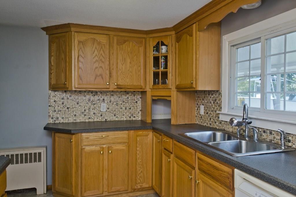 34 Glenn Street Three Rivers, MA 01080 - Photo 8 of 40 a kitchen with stainless steel appliances granite countertop a sink and cabinets