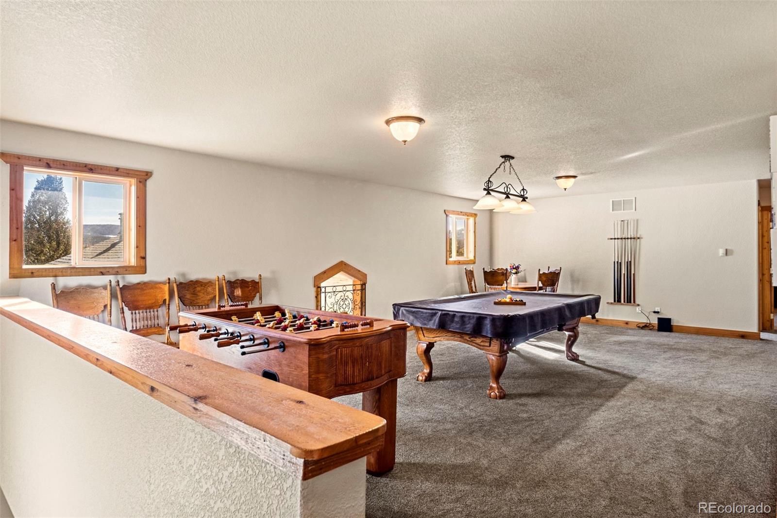 412 Evergreen Road Black Hawk, CO 80422 - Photo 31 of 48 a living room with furniture a piano and a table