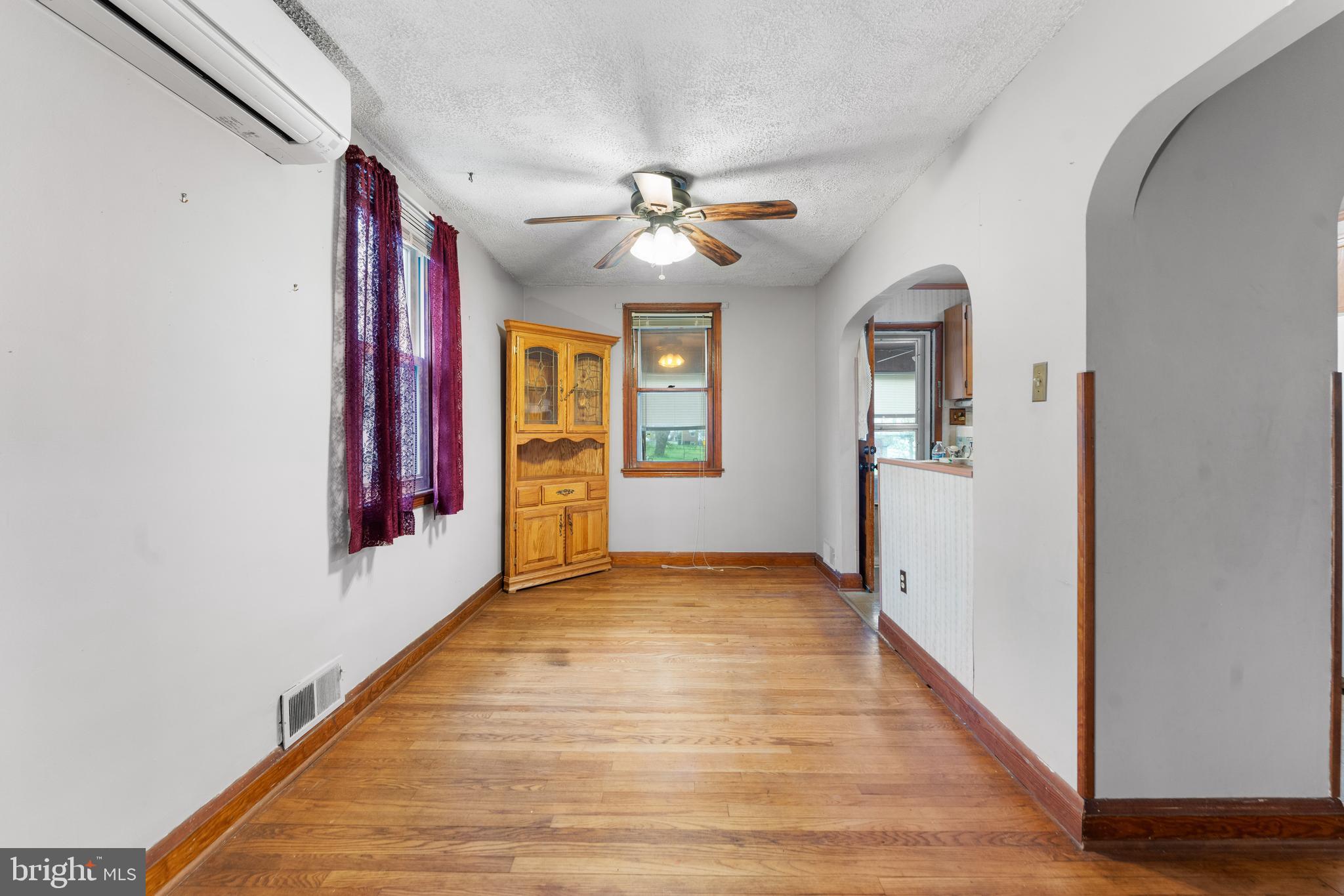 24 Mansion Road Linthicum Heights, MD 21090 - Photo 12 of 35 a view of an empty room with window and wooden floor