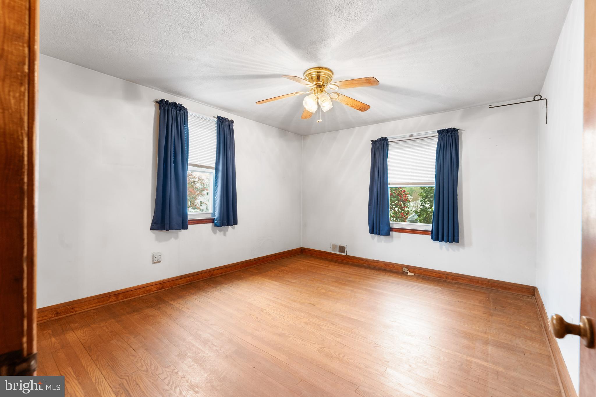 24 Mansion Road Linthicum Heights, MD 21090 - Photo 13 of 35 an empty room with windows and ceiling fan