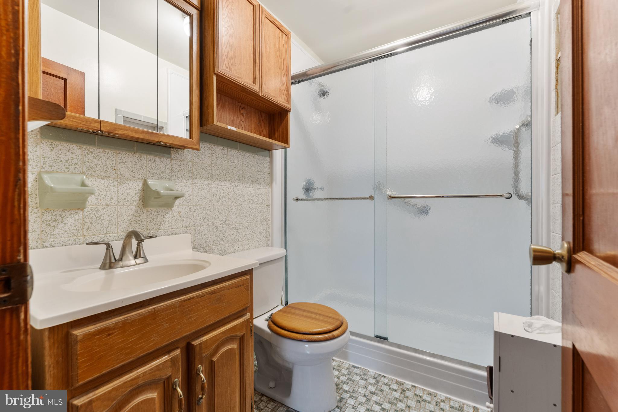 24 Mansion Road Linthicum Heights, MD 21090 - Photo 17 of 35 a bathroom with a sink a toilet and shower
