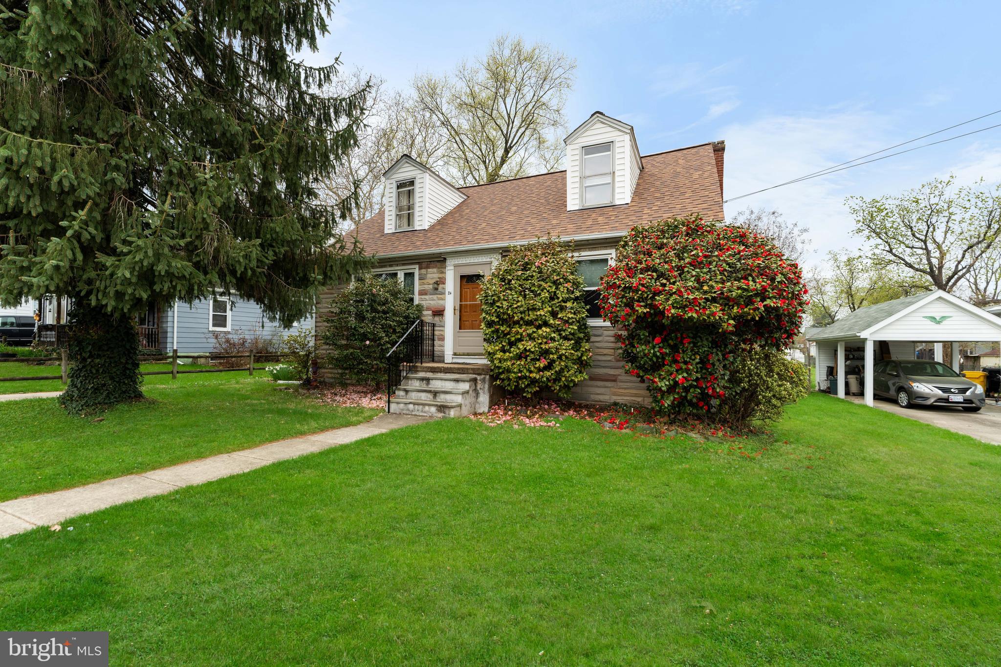 24 Mansion Road Linthicum Heights, MD 21090 - Photo 2 of 35 a front view of a house with a garden