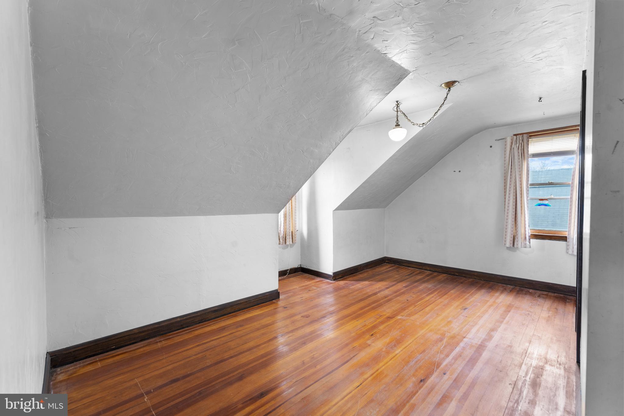 24 Mansion Road Linthicum Heights, MD 21090 - Photo 22 of 35 a view of an empty room with wooden floor and a window