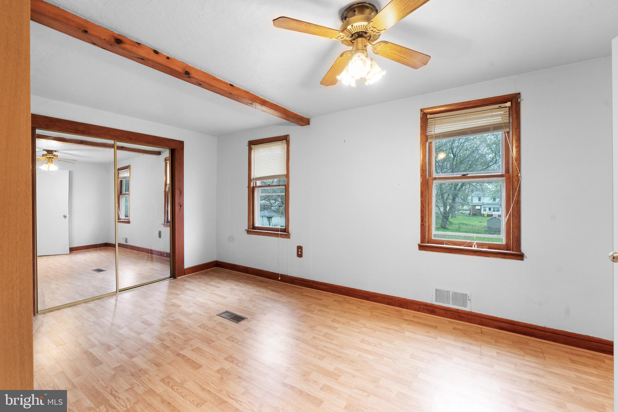 24 Mansion Road Linthicum Heights, MD 21090 - Photo 24 of 35 a view of an empty room with window and wooden floor