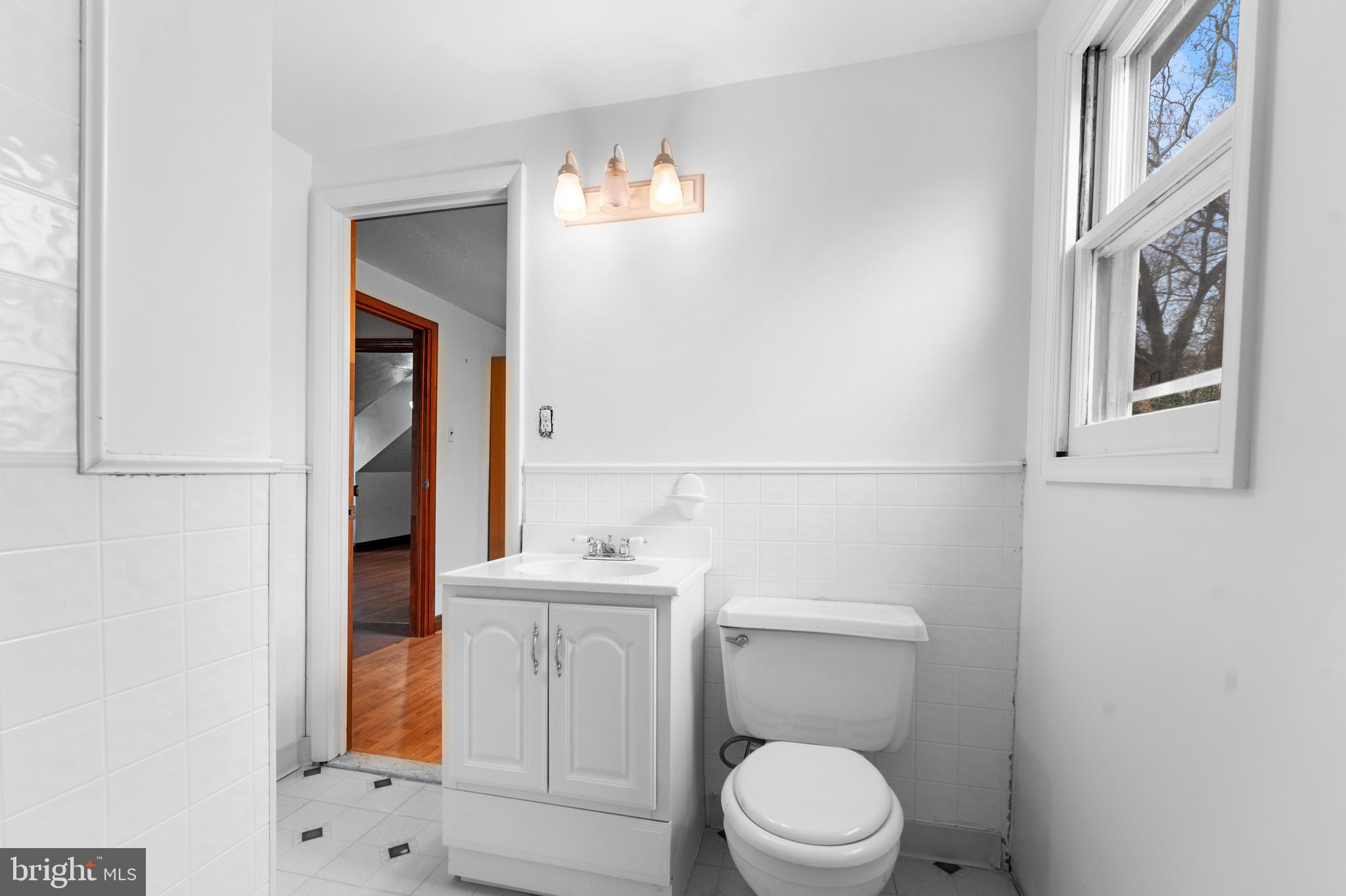 24 Mansion Road Linthicum Heights, MD 21090 - Photo 26 of 35 a white toilet sitting next to a bathroom sink
