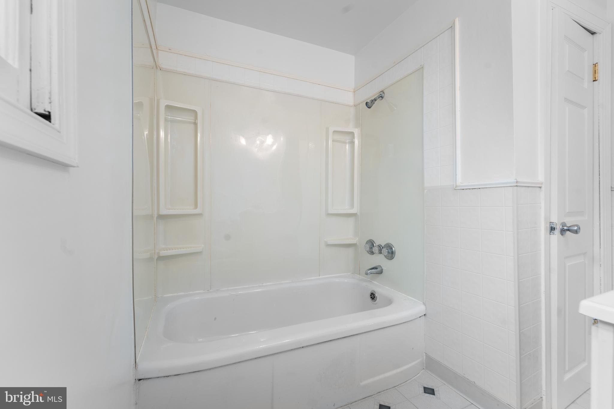 24 Mansion Road Linthicum Heights, MD 21090 - Photo 27 of 35 a white bath tub sitting next to a shower