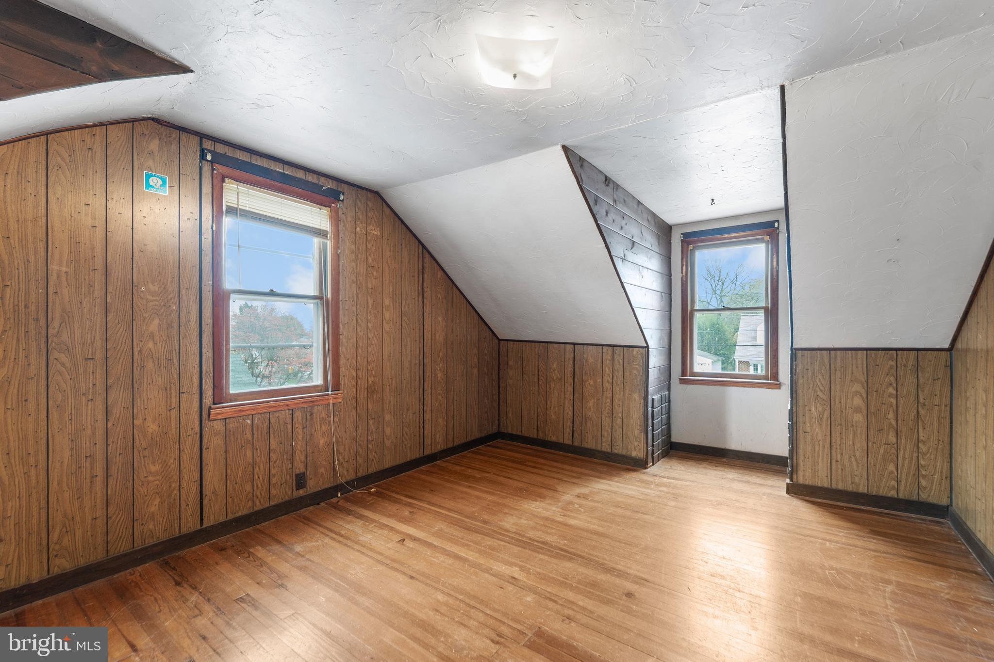 24 Mansion Road Linthicum Heights, MD 21090 - Photo 28 of 35 an empty room with wooden floor and windows