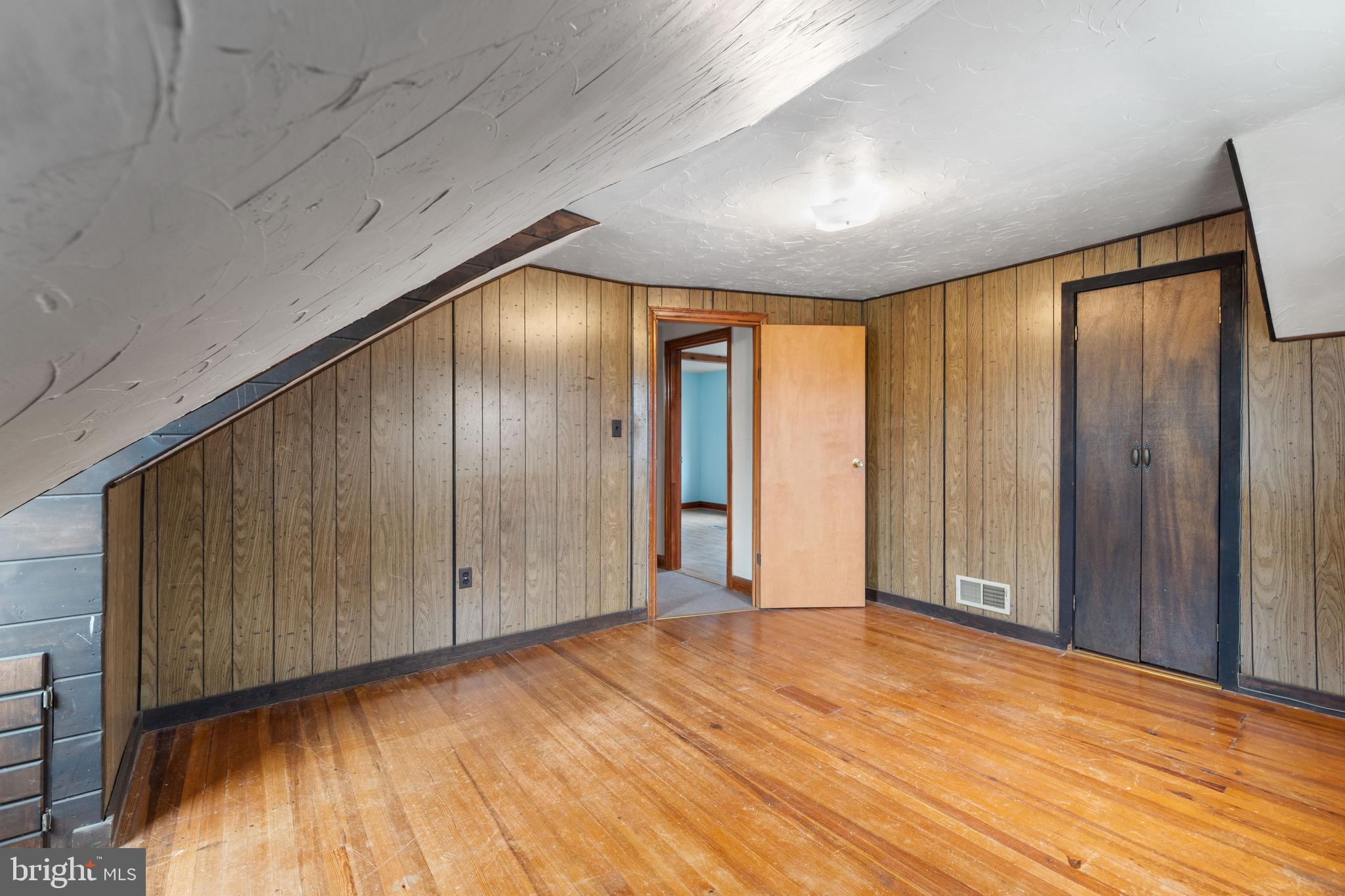 24 Mansion Road Linthicum Heights, MD 21090 - Photo 29 of 35 a view of an empty room with wooden floor and a window