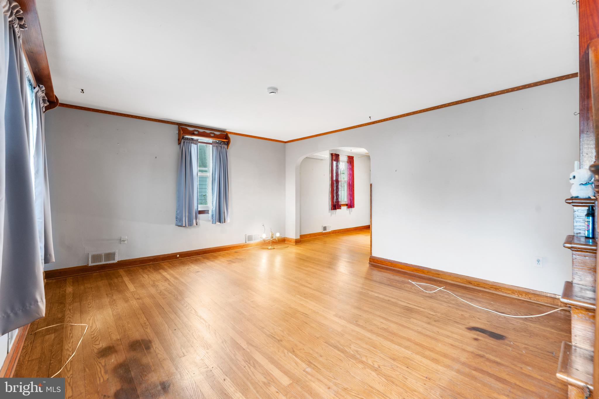 24 Mansion Road Linthicum Heights, MD 21090 - Photo 10 of 35 a view of an empty room with window and wooden floor