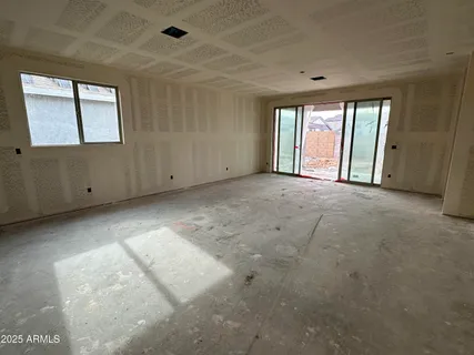 a view of an empty room with windows