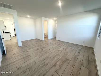 a bathroom with a sink toilet and a mirror