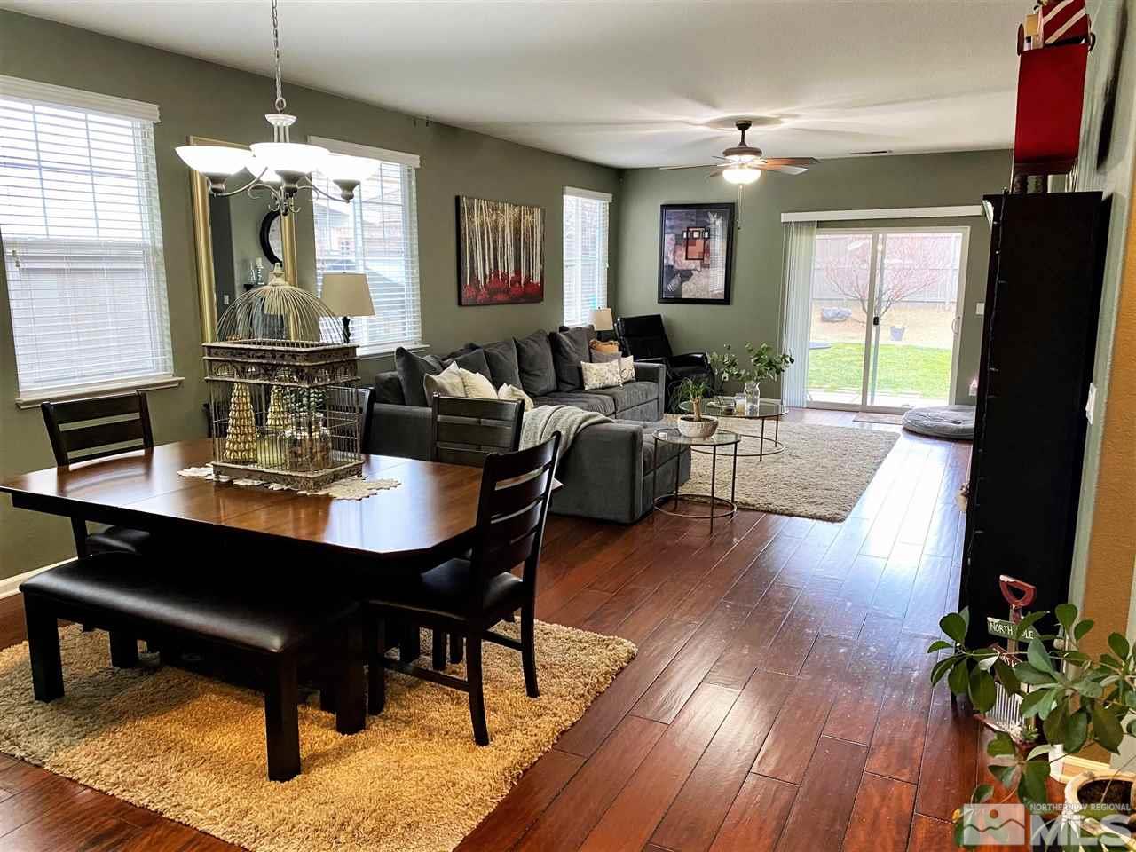 590 Needles Court Reno, NV 89521 - Photo 5 of 15 a view of a dining room with furniture window and wooden floor