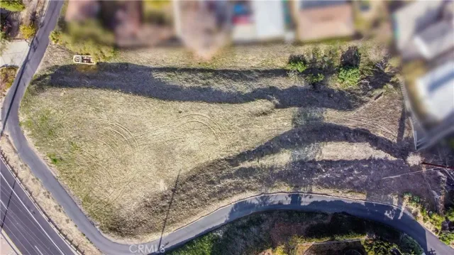 a view of a backyard with wooden fence
