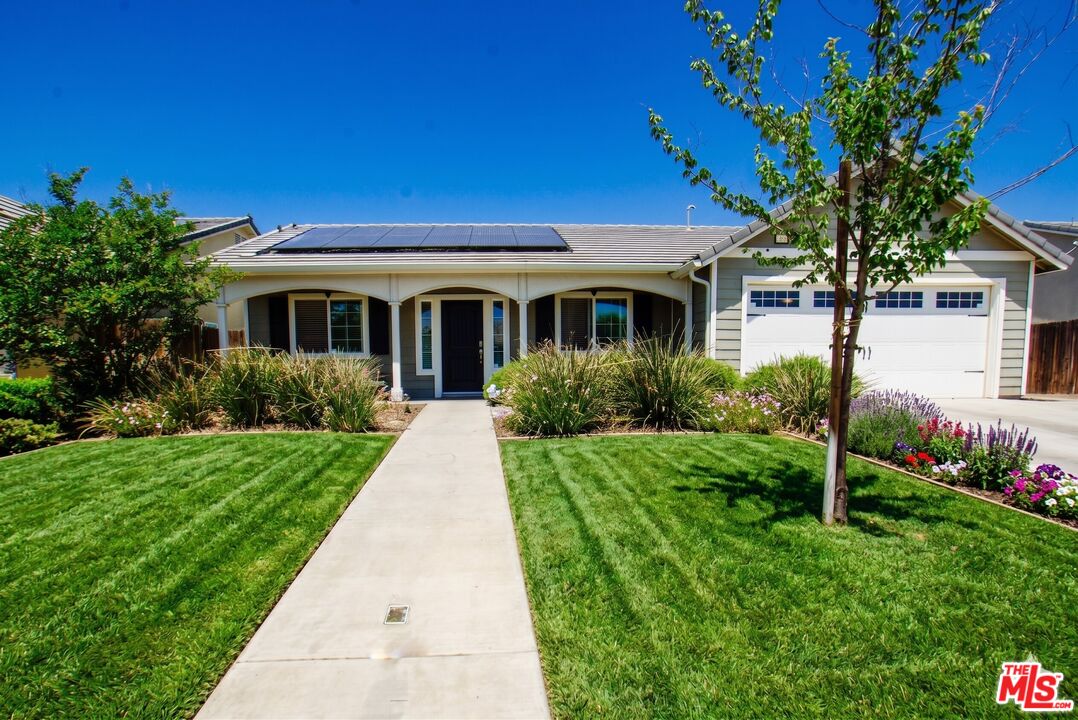 6014 Samuelson Street Bakersfield, CA 93313 - Photo 1 of 25 a front view of a house with a yard