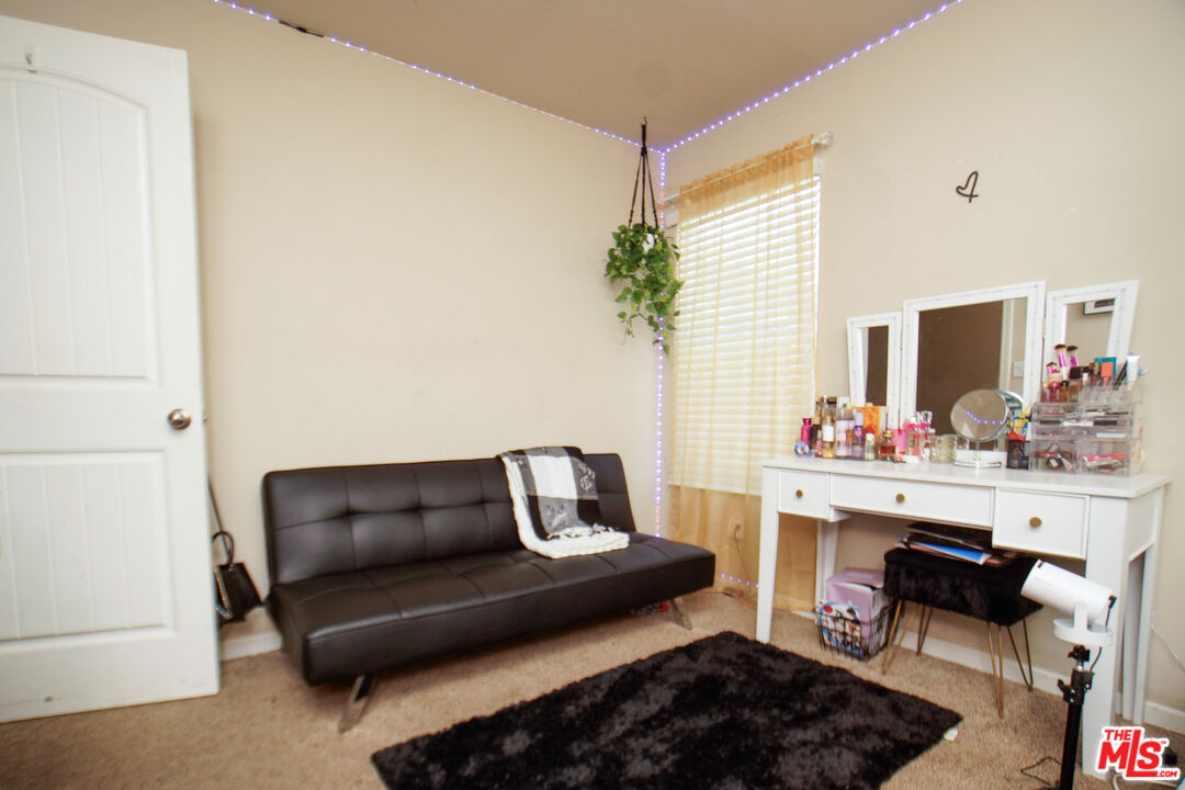 6014 Samuelson Street Bakersfield, CA 93313 - Photo 11 of 25 a living room with furniture and a potted plant