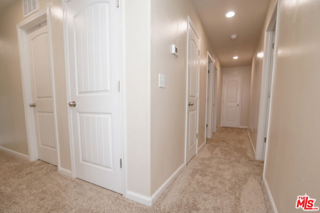 6014 Samuelson Street Bakersfield, CA 93313 - Photo 13 of 25 a view of a hallway with shower