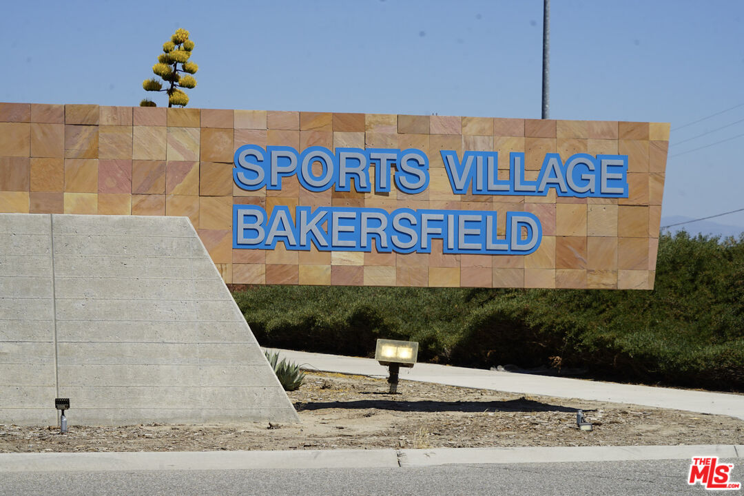 6014 Samuelson Street Bakersfield, CA 93313 - Photo 25 of 25 a street sign on a wall next to a road
