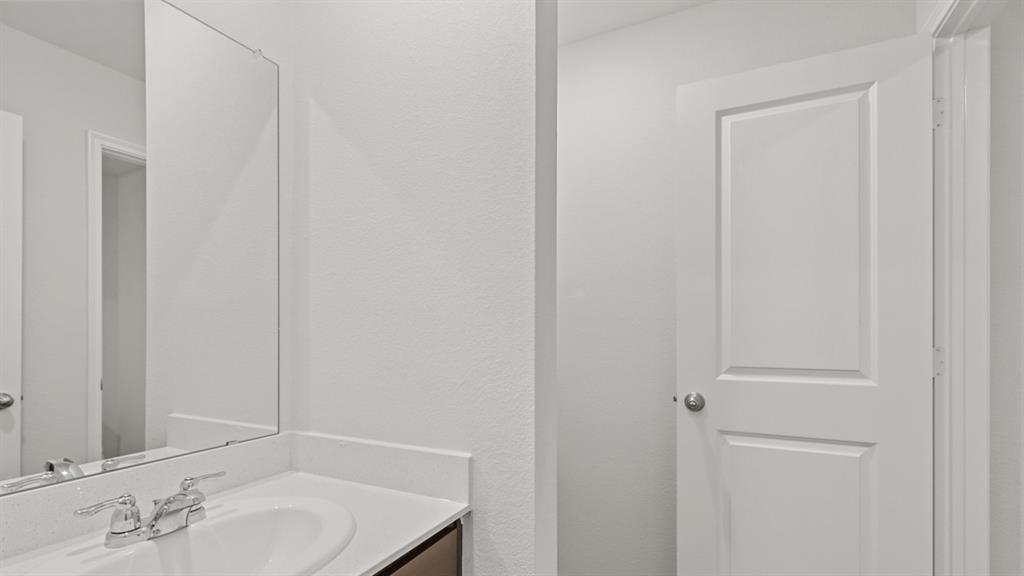 1913 Reveille Way Terrell, TX 75160 - Photo 18 of 35 Bathroom with vanity and a textured wall