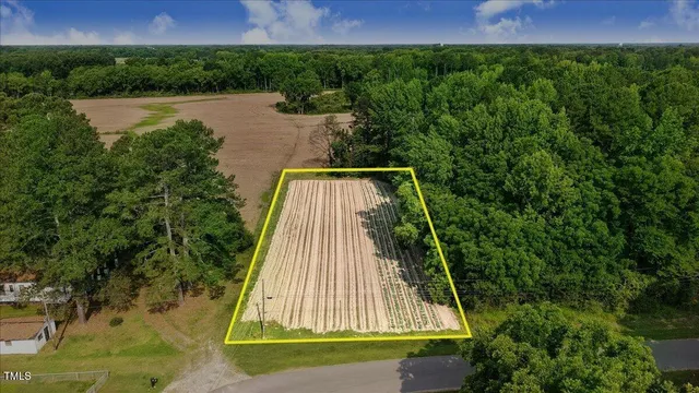 a view of backyard with swimming pool and outdoor seating