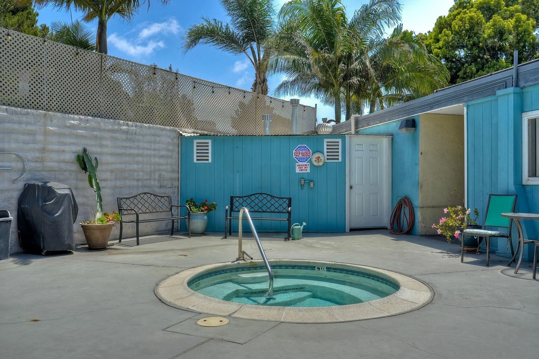 3606 Vista Rey, Unit 46 Oceanside, CA 92057 - Photo 26 of 36 a backyard of a house with fountain table and chairs