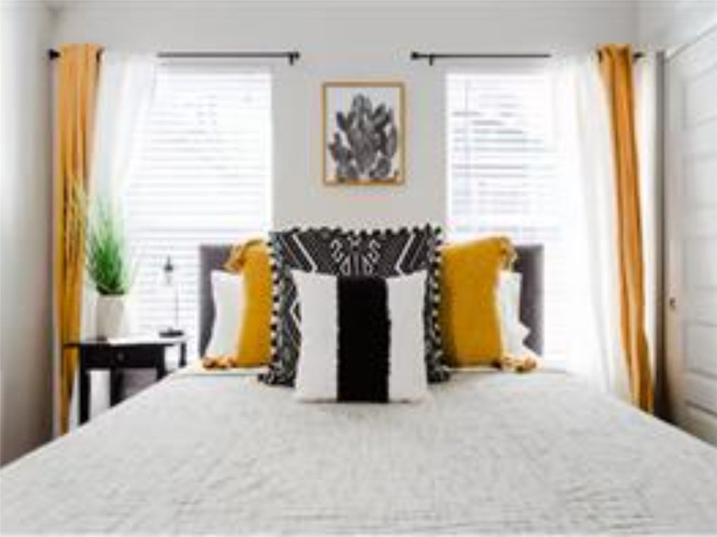 1139 1/2 Poquito Street, Unit 3 Austin, TX 78702 - Photo 19 of 23 a bed room with a bed and a window