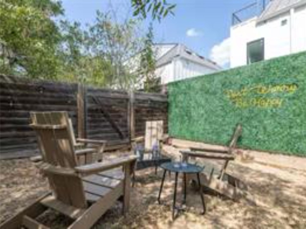 1139 1/2 Poquito Street, Unit 3 Austin, TX 78702 - Photo 22 of 23 a view of backyard with outdoor seating and plants